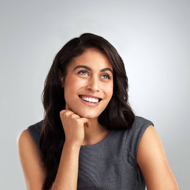 Woman in Grey Smiling